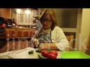 old woman cutting vegtables