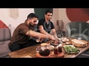 Men eating foul and oriental Egyptian breakfast in the living