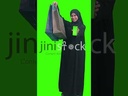 Khaliji woman holding a mobile with green screen and shopping bag