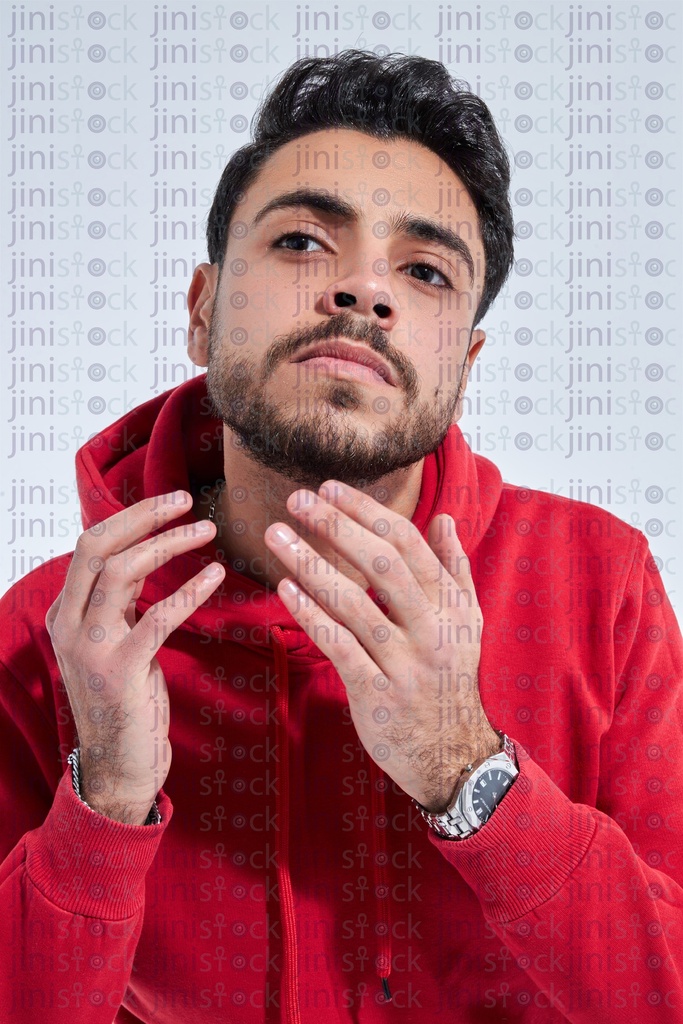 young man checking his beard close up