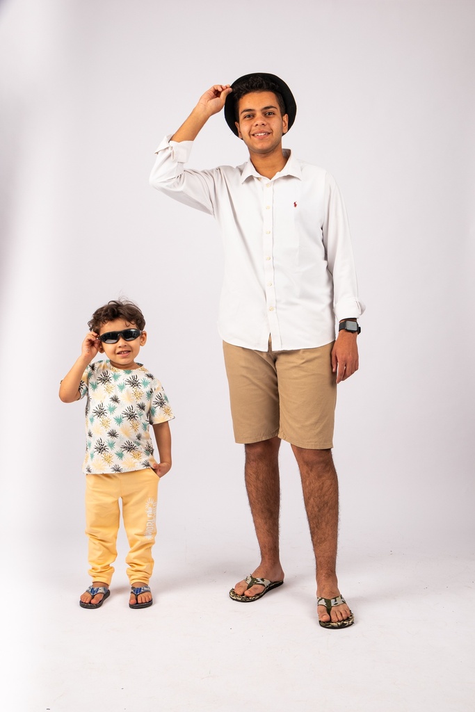 father and son wearing sunglasses - stock image