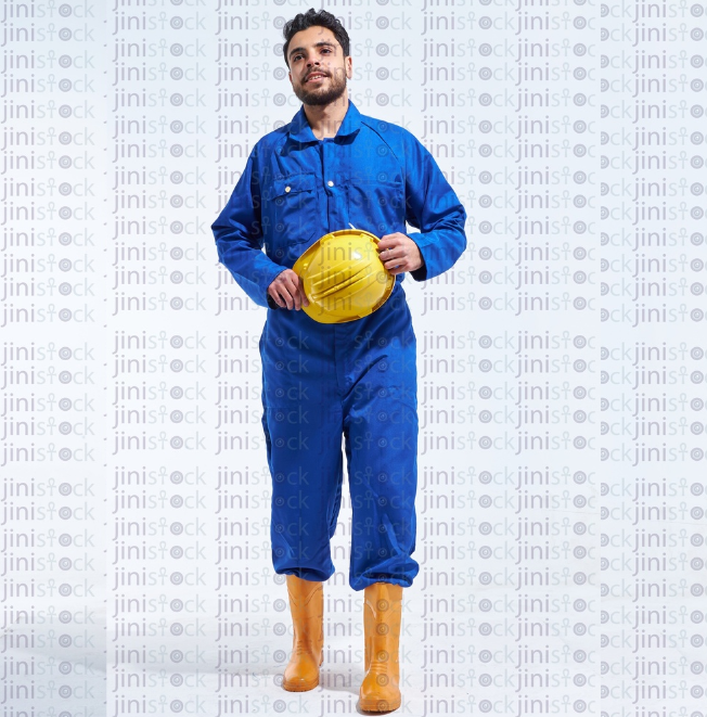 young worker standing with his hat in his hands