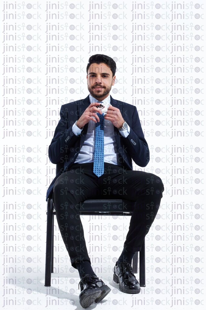 Employee in a business suite drinking coffee