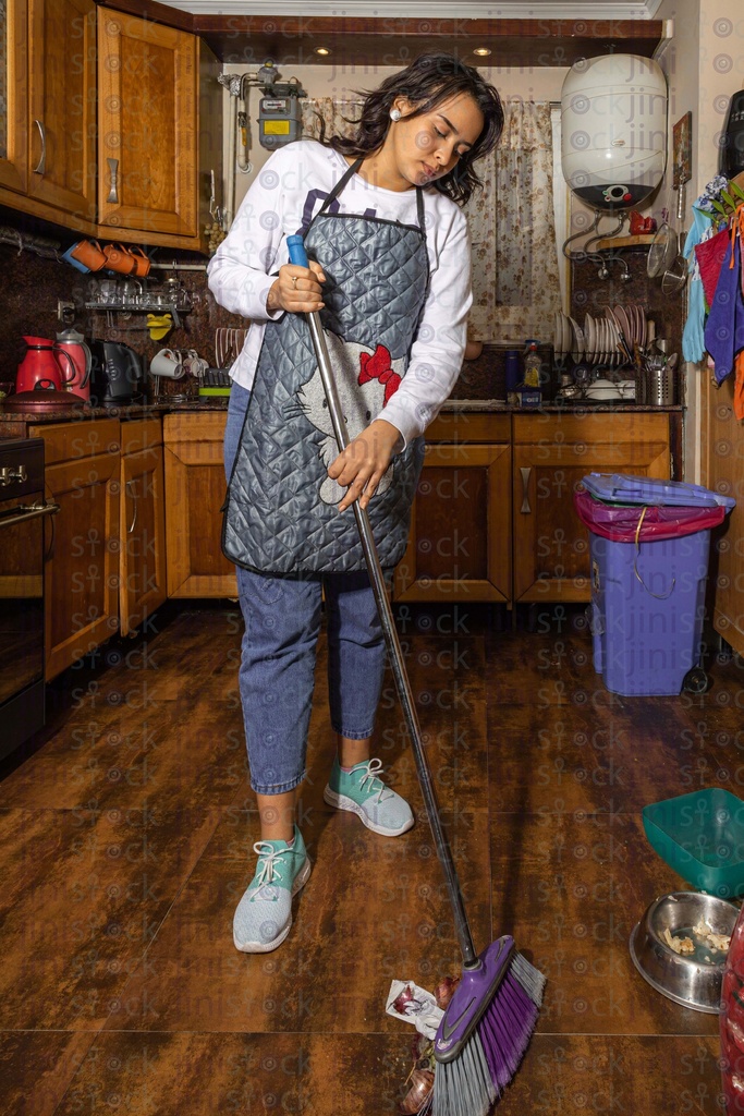 Egyptian woman cleaning the kitchen