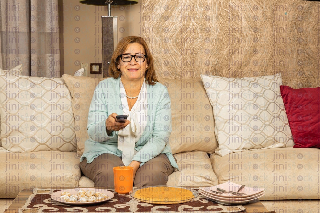 grandmother sitting watching TV