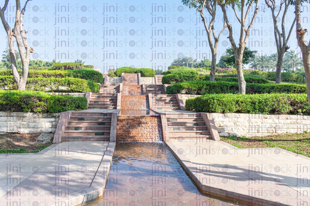 fountain or waterfall in a beautiful green landscape