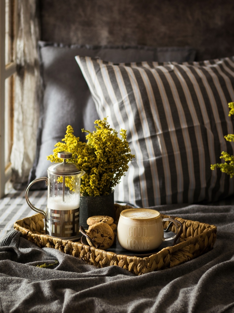 Mocha with cookies breakfast on a bed - stock image