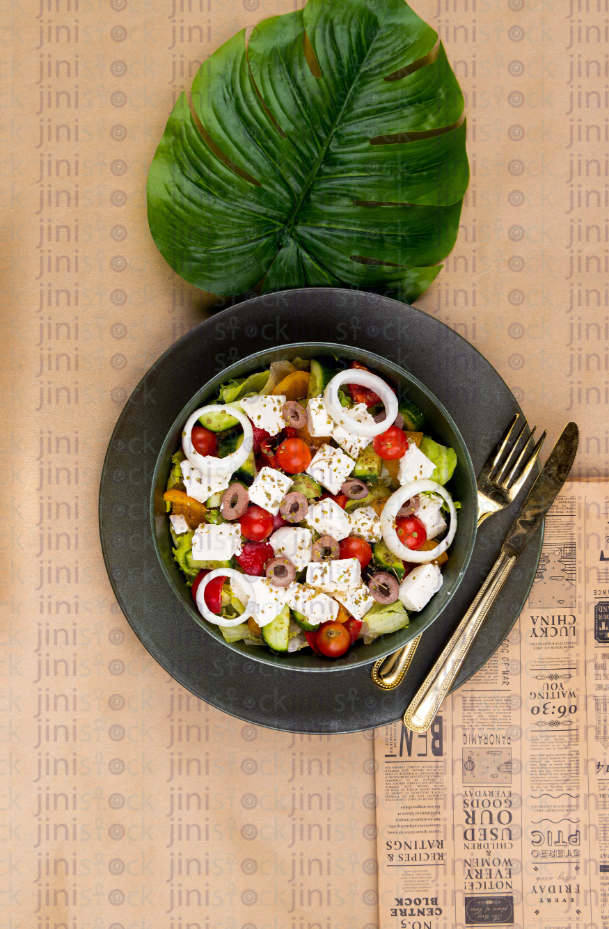 Greek salad on a gray plate