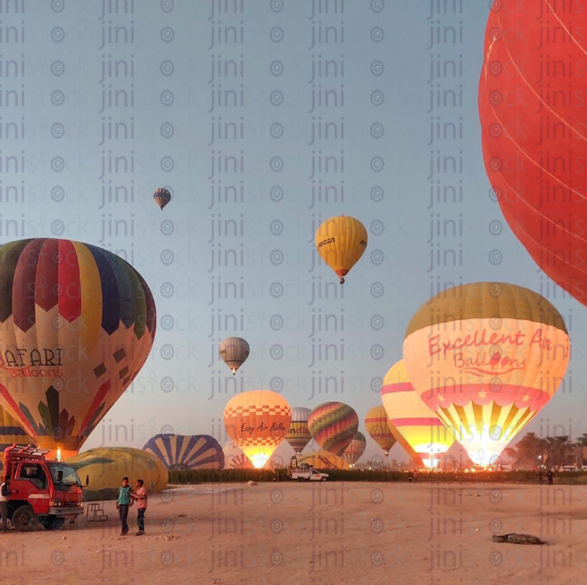 Nature beauty in Aswan el Nuba Egypt. Air balloon in Luxor flying over a green field. farming lands