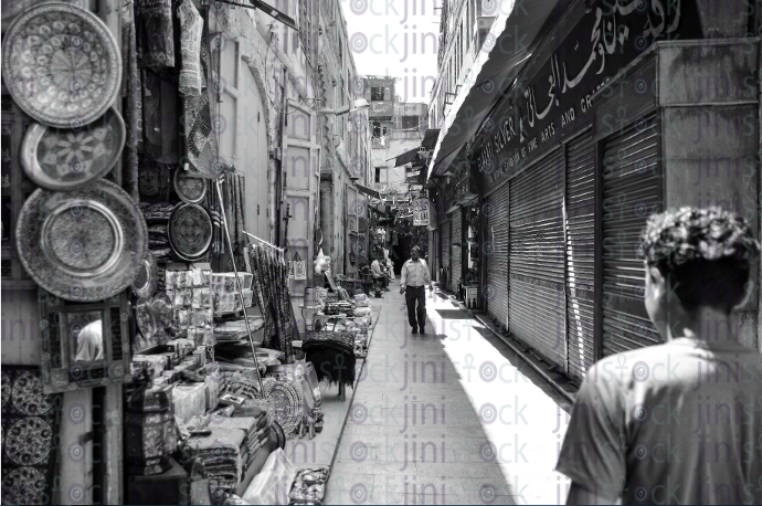 man walkinging in old cairo streets - stock image