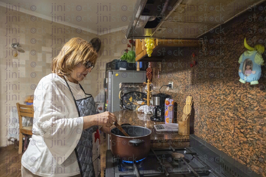 old woman cooking in the kitchen