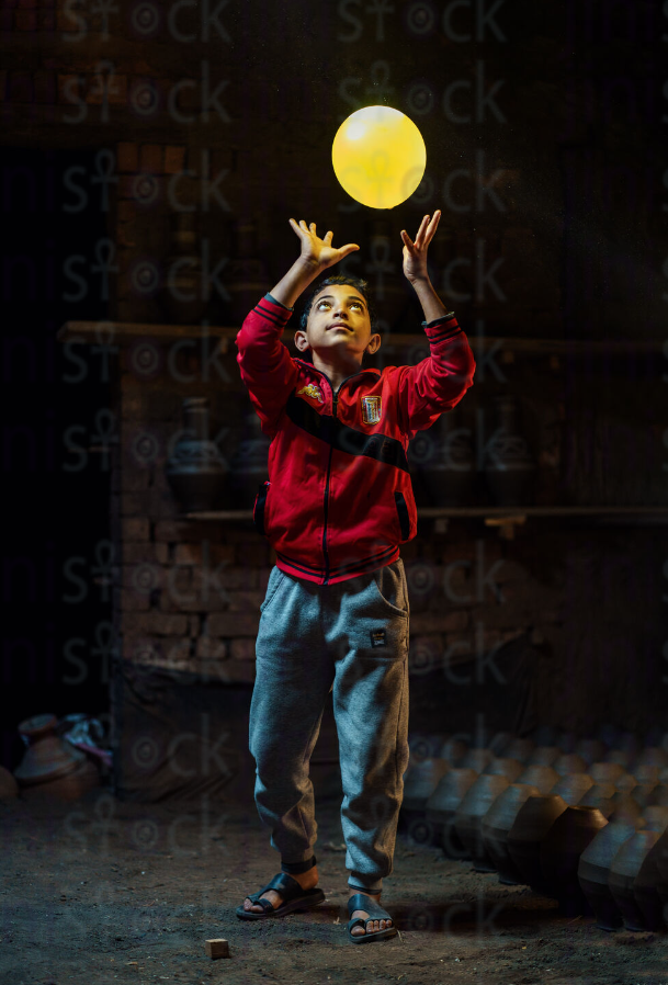 Boy playing with a balloon stock image