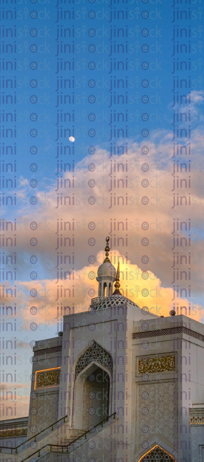 orange sky behind modern mosque in Ramadan stock images