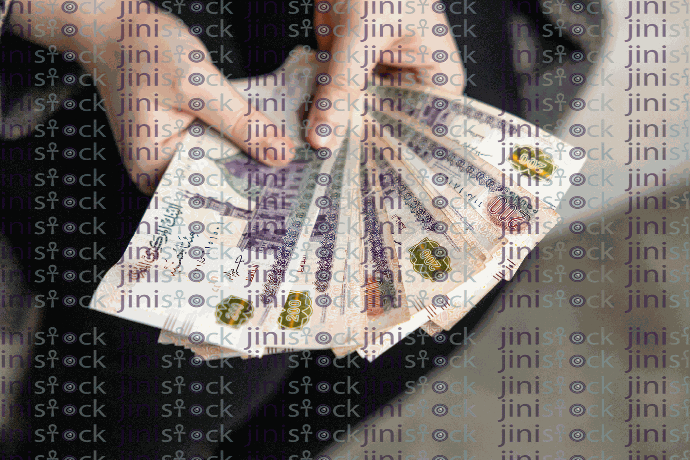 A high-quality stock image displaying a hand holding numerous 200 EGP Egyptian currency bills.