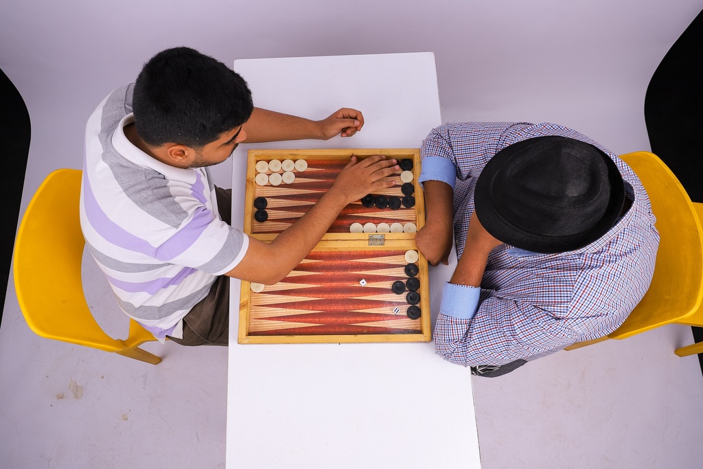 two friends playing tawla.