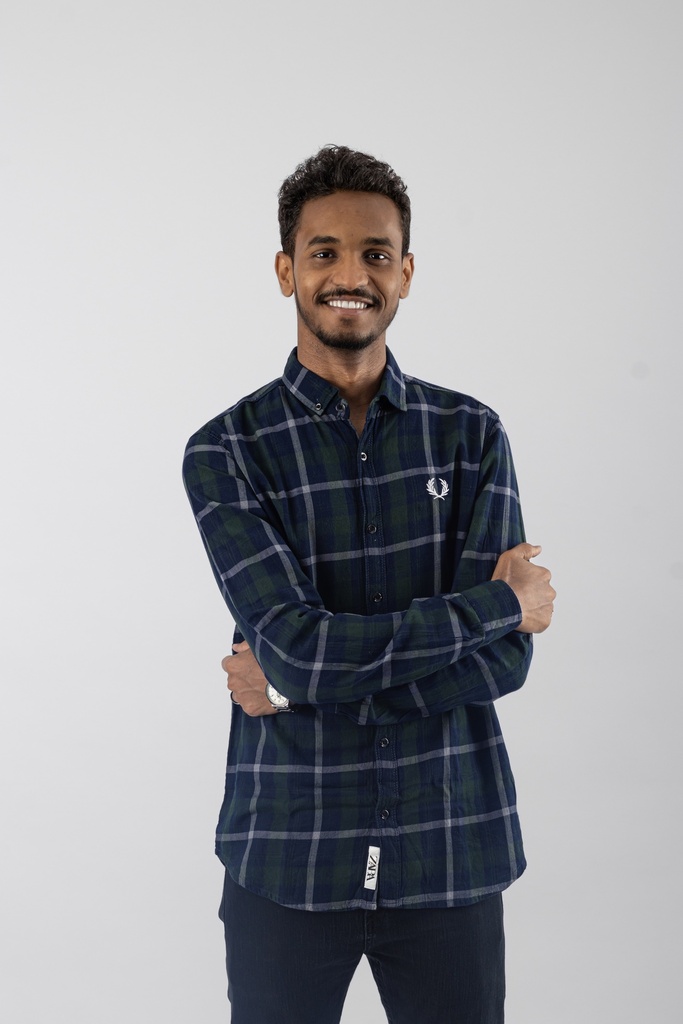 young Sudanese man standing with confidence