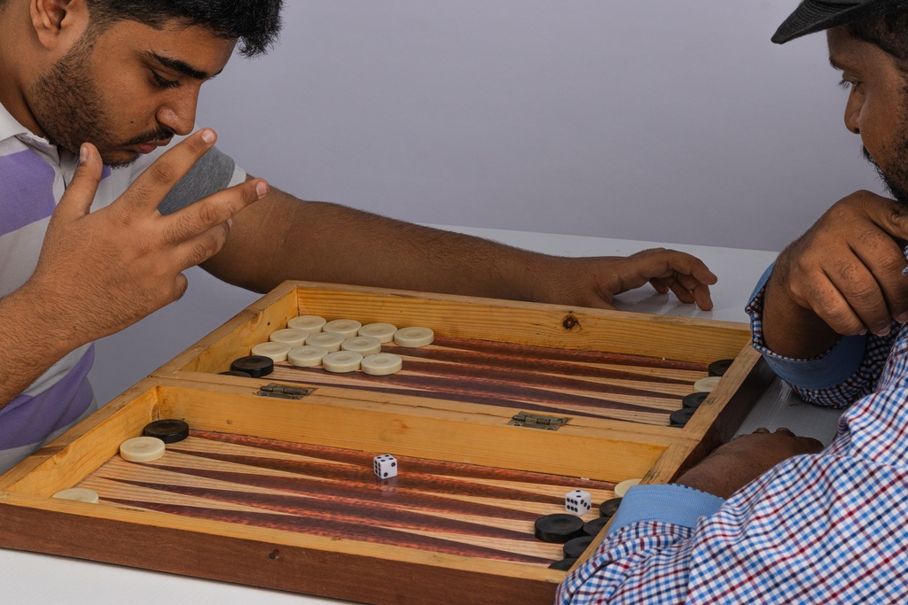 Two friend playing tawla