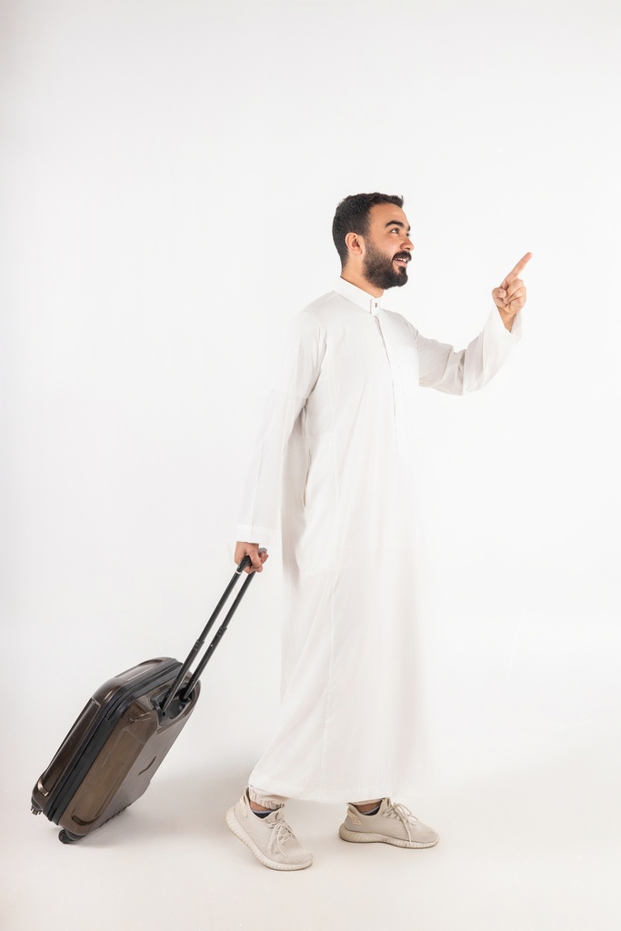 a khaliji man travelling with his bag stock image