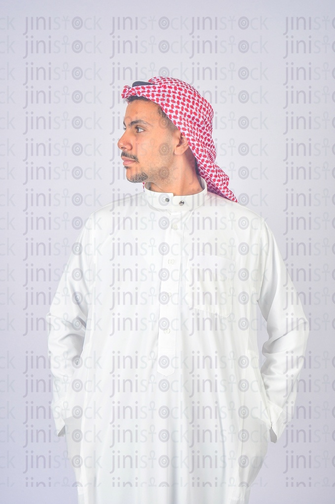 Gulf model looking at something and putting his hands in his pocket