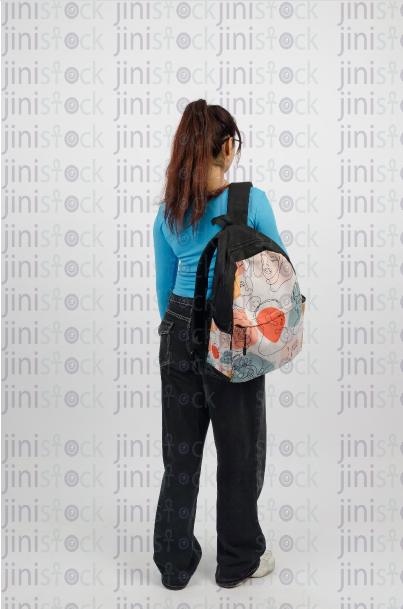 Girl wearing a backpack - close-up background shot - stock image