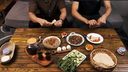 Men eating foul and oriental Egyptian breakfast