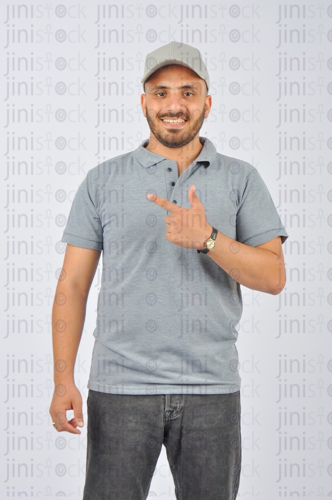 A delivery guy wearing a gray cap and t-shirt uniform pointing his index finger at something