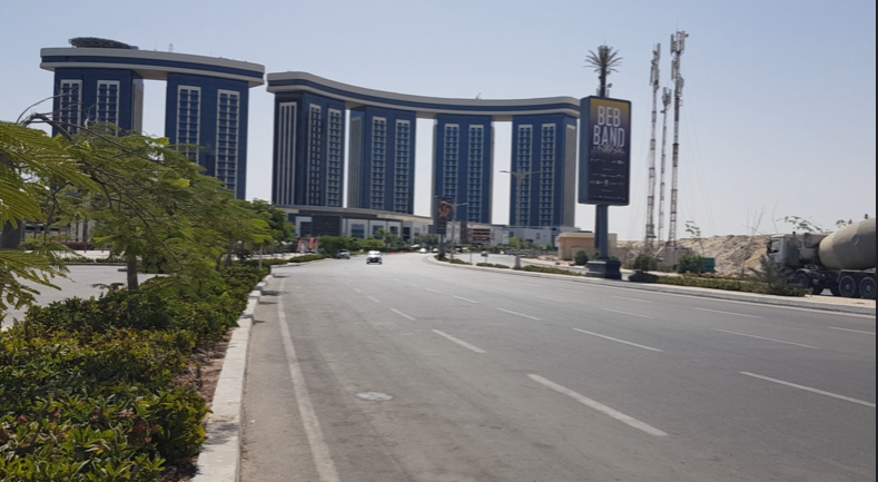 cars moving traffic in front of north mall