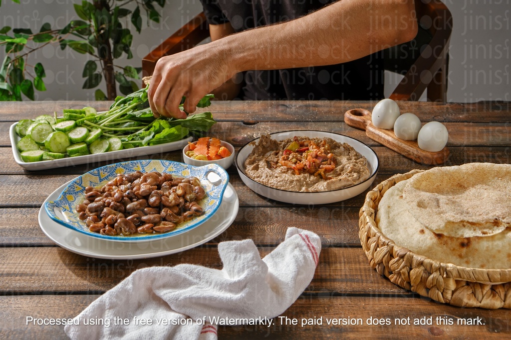 man eating traditional Egyptian breakfast