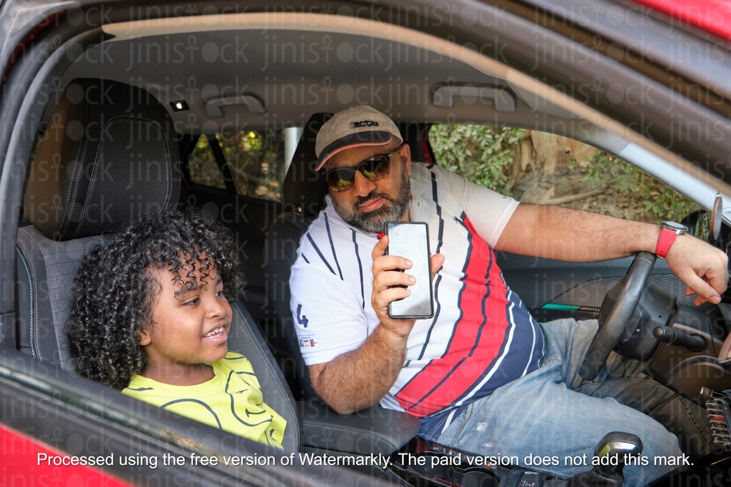 father and son in the car