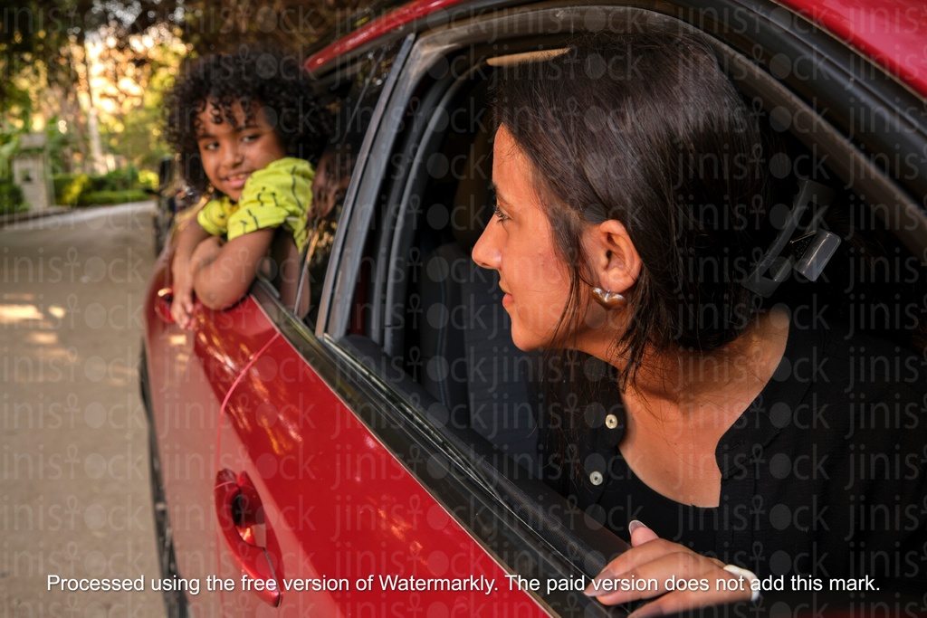 mother looking at her son from the car window