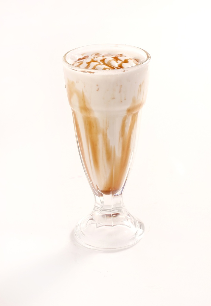 creamy caramel milkshake topped with caramel sauce whipped cream