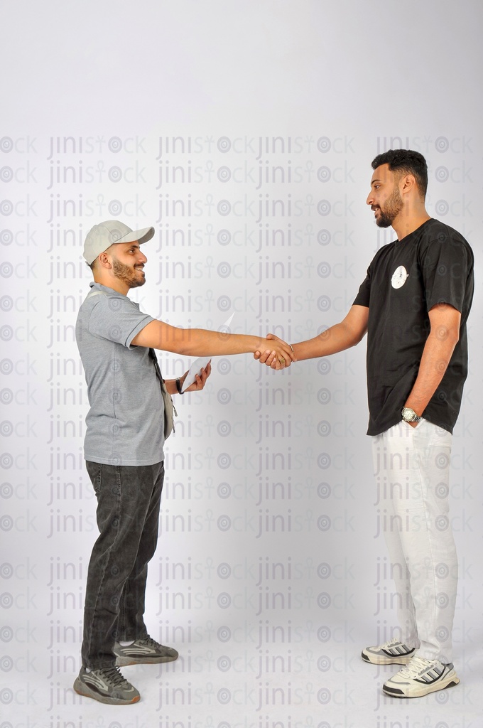 a delivery man shaking hands with the customer