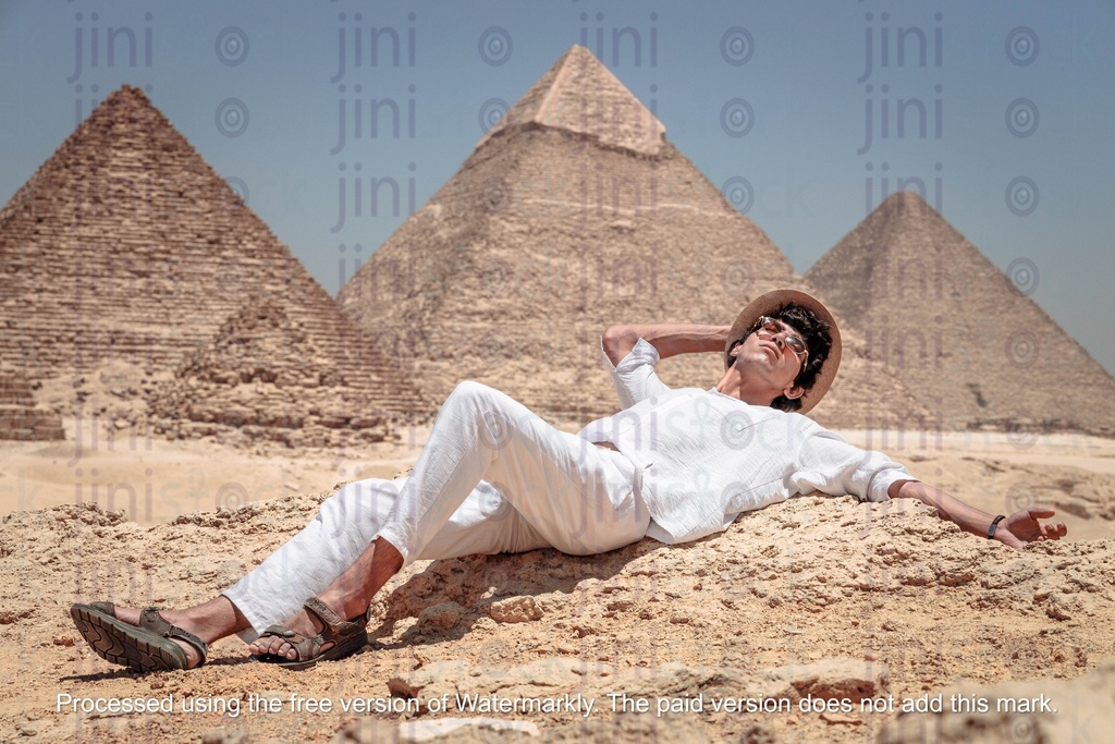 man sun tanning at the giza pyramids