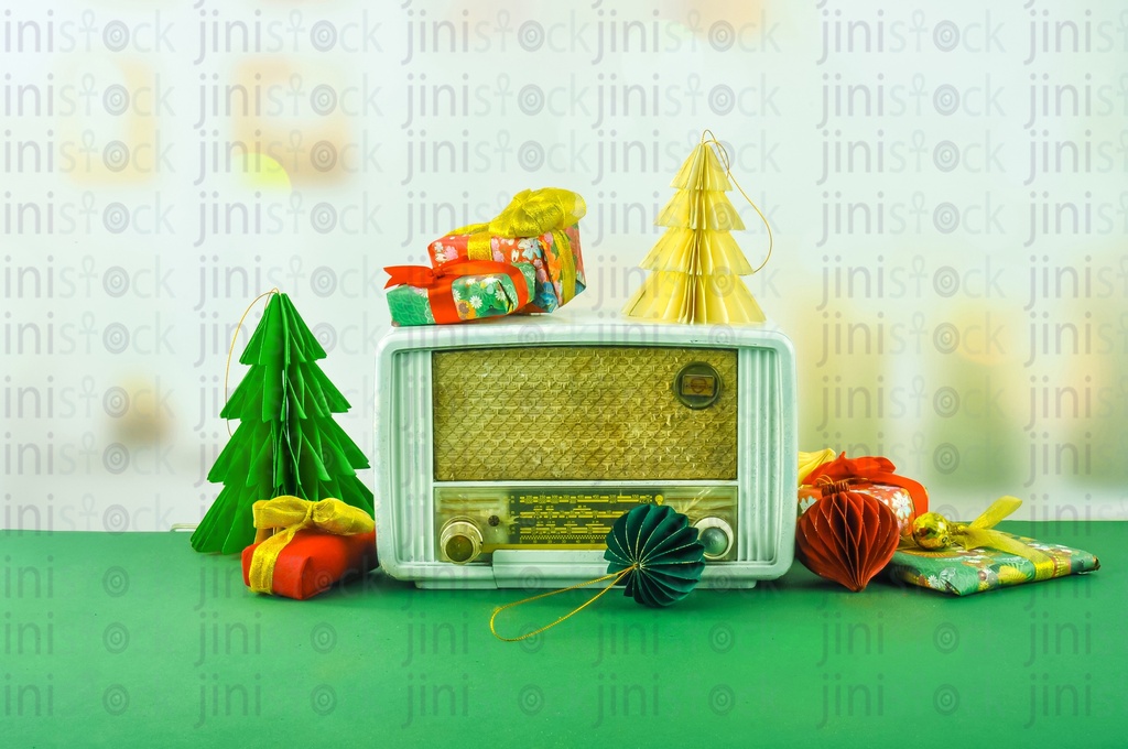 An old radio between Christmas and new year ornament.