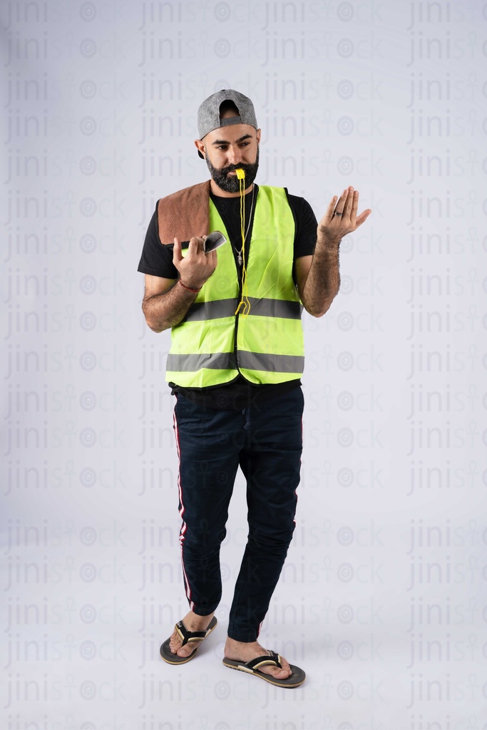 Sais an Egyptian parking attendant signing and guiding a car to park