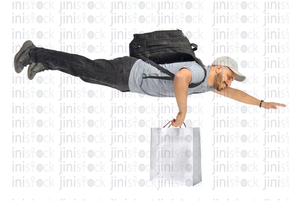 Flying courier with a backpack, gray t-shirt, and gray cap and holding bag in his hand