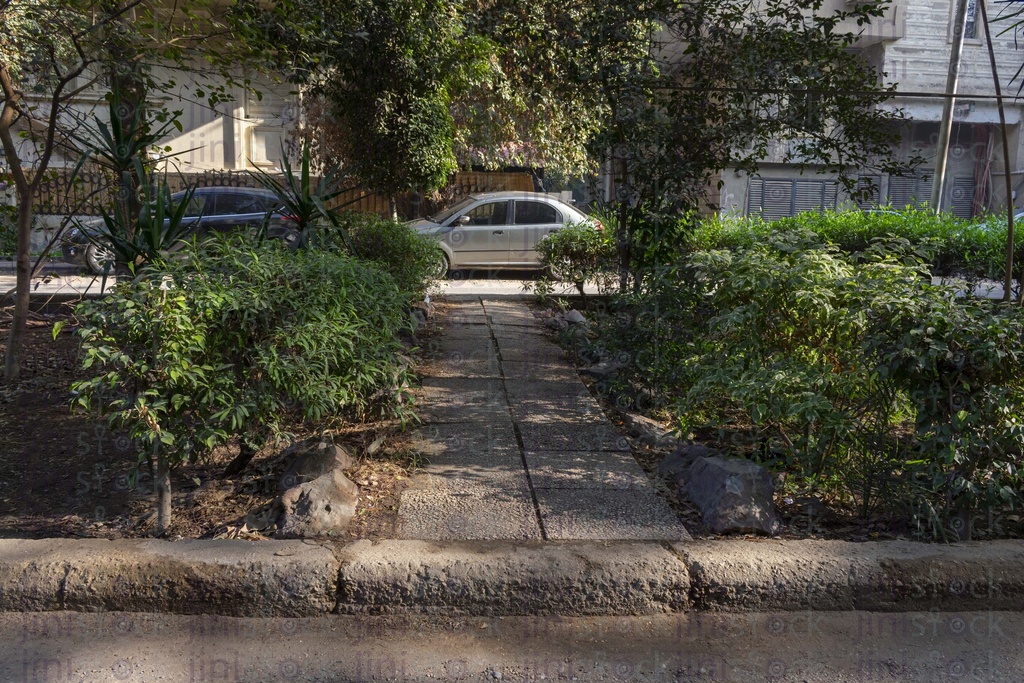 Narrow path in a garden high stock image