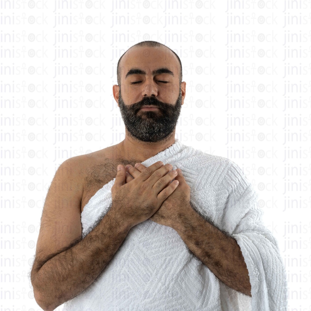 close up on a man praying in umrah