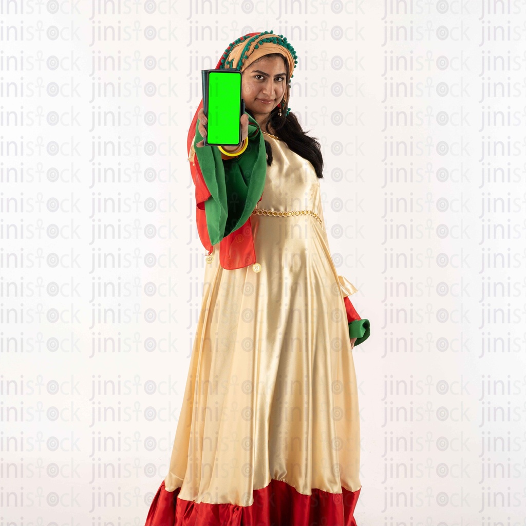 egyptian woman farmer holding a mobile with green screen