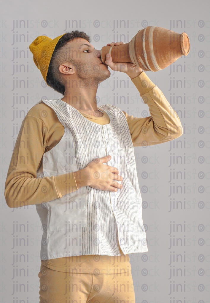 Egyptian farmer drinking water from Qola.