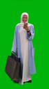 veiled woman talking on the mobile while shopping