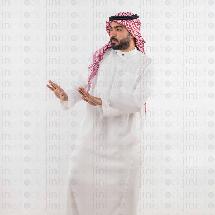 A man from gulf stock image on isolated background making a stop sign with his hands