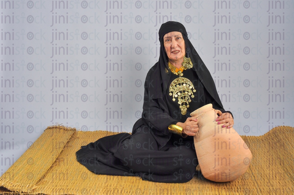 upper Egypt woman sitting on the land.