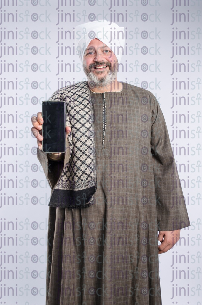 Egyptian man from upper egypt holding mobile