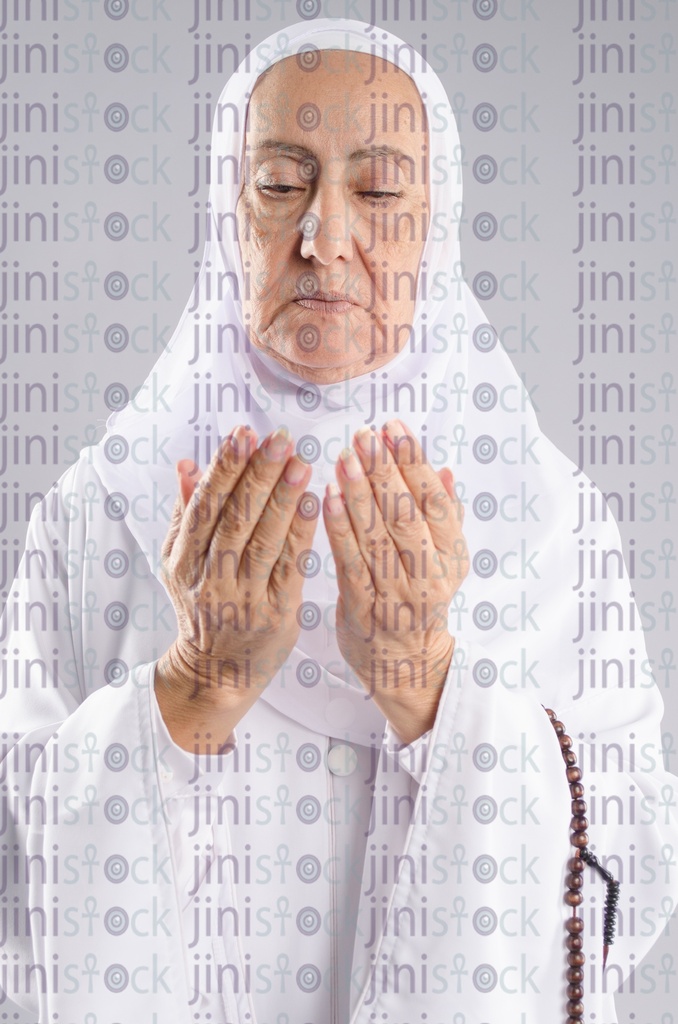 Old Egyptian woman praying