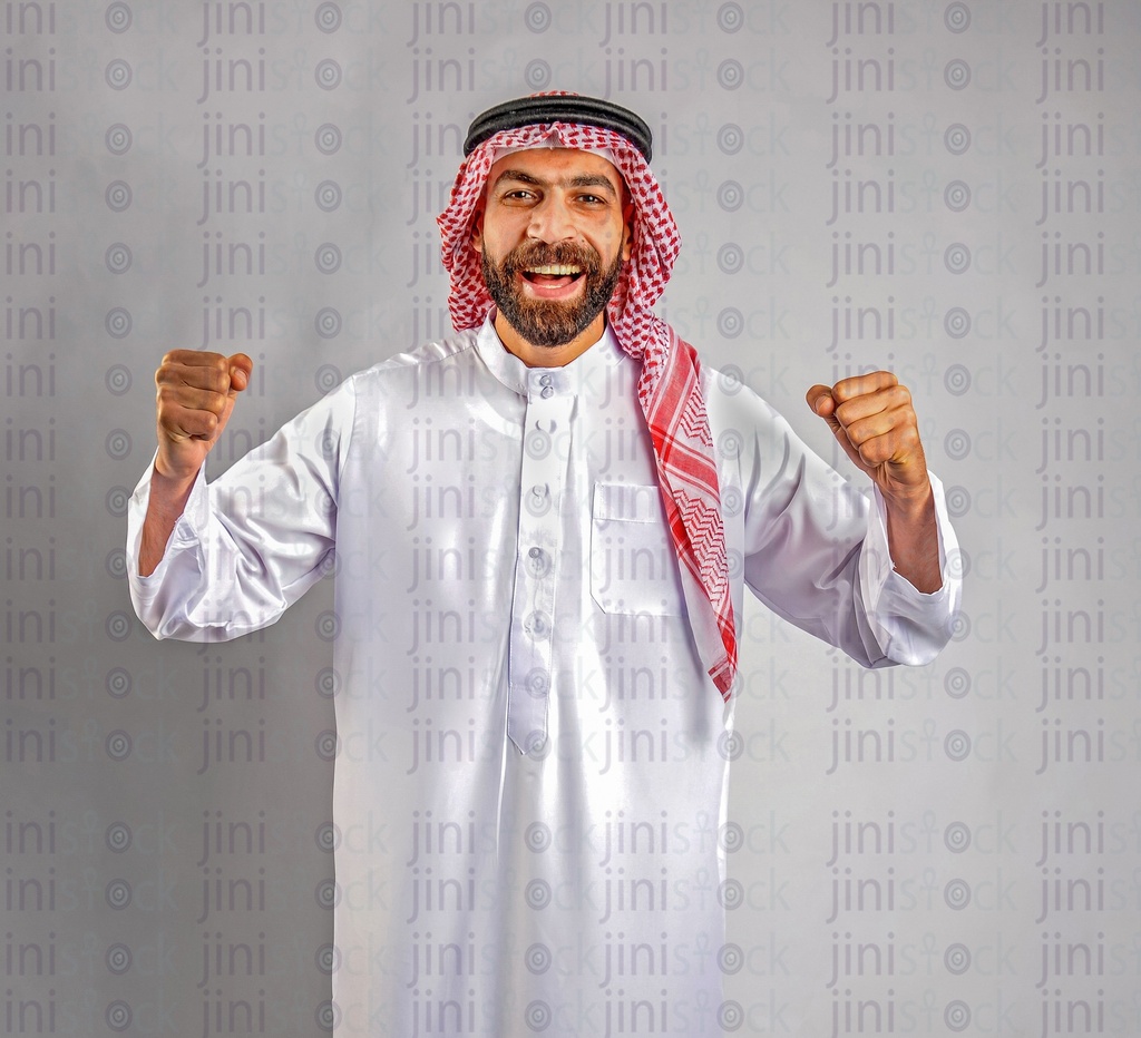 Khaliji or Saudi man doing the winner sign.