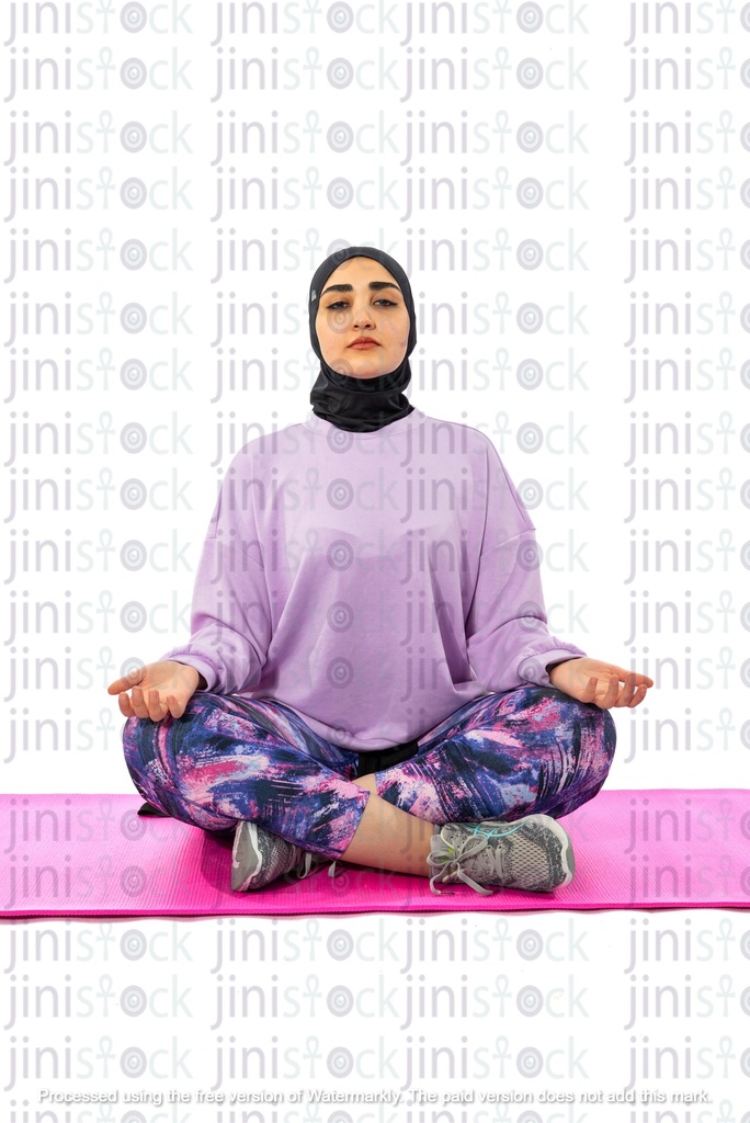 Egyptian girl wearing hijab and doing yoga