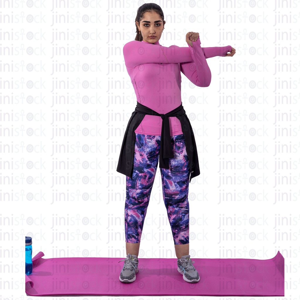 Young Egyptian woman stretching before exercising