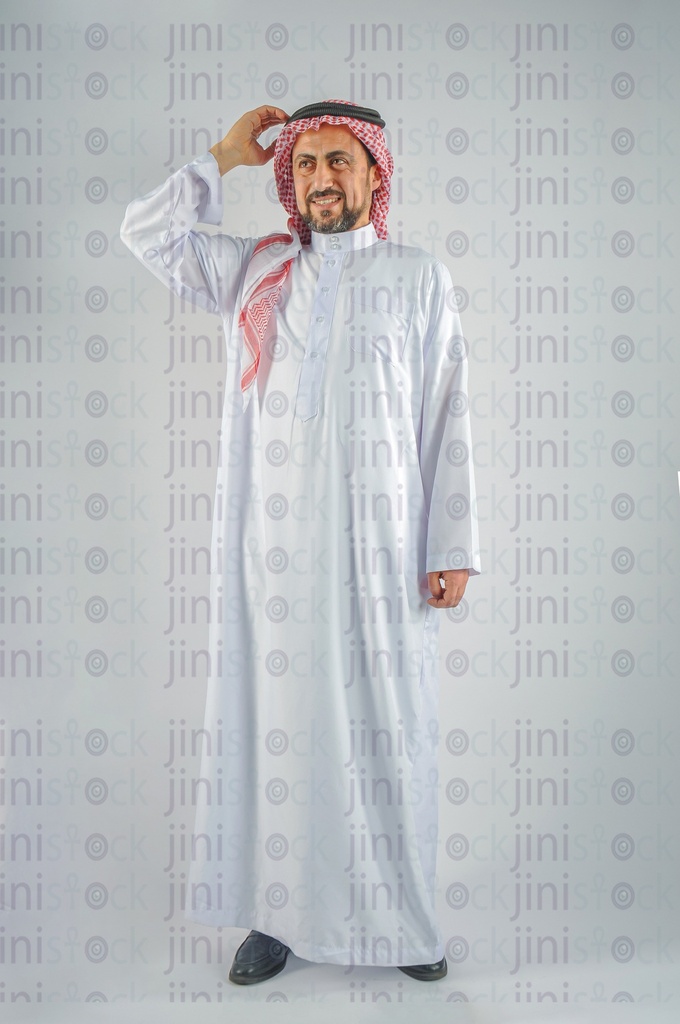 Khaliji Saudi Arabian or Emirati man or a man from the Gulf thinking in an idea and putting his hand on his head.