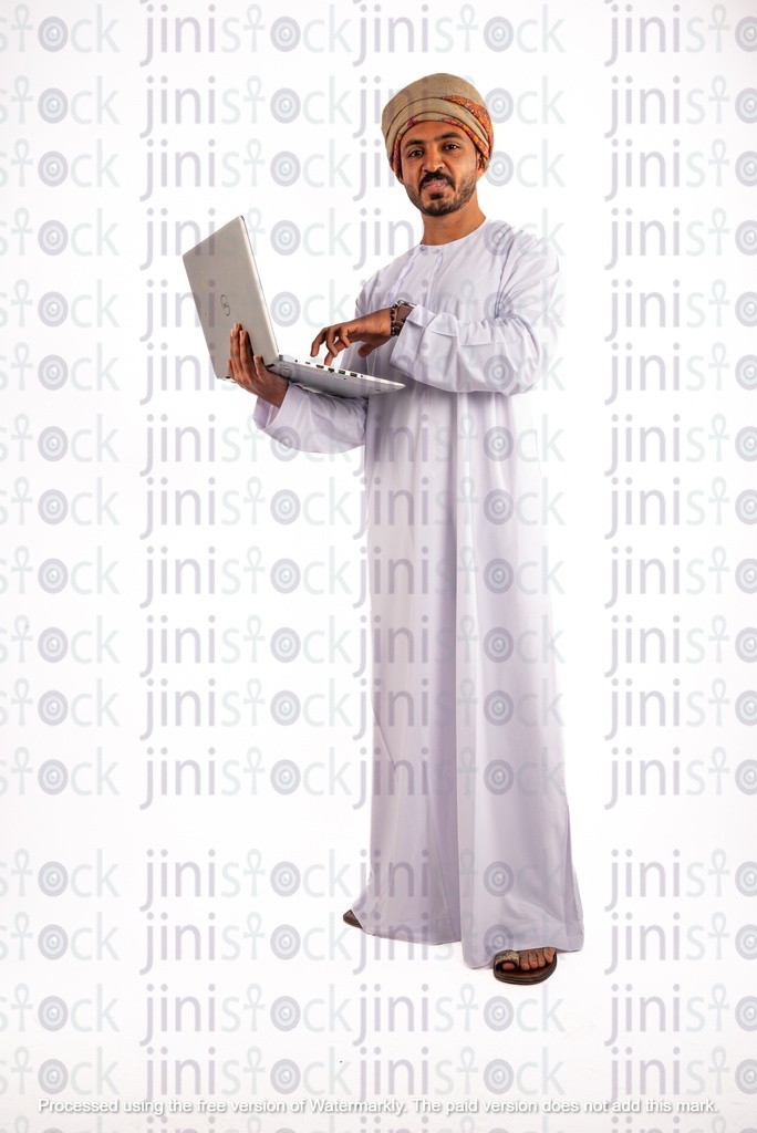 Omani arab khaliji man holding a laptop